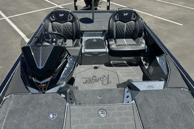 Slide: The Image of 2026 Ranger Z521R boat interior with dual black seats and sleek dashboard design. - 13