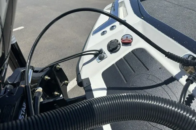 Slide: The Image of 2026 Ranger Z521R boat dashboard with control cables and switches. - 19