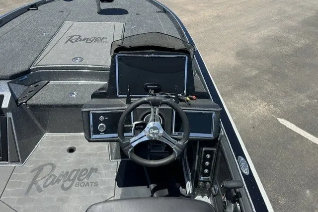 Slide: The Image of 2026 Ranger Z521R boat cockpit with steering wheel and dashboard controls. - 11