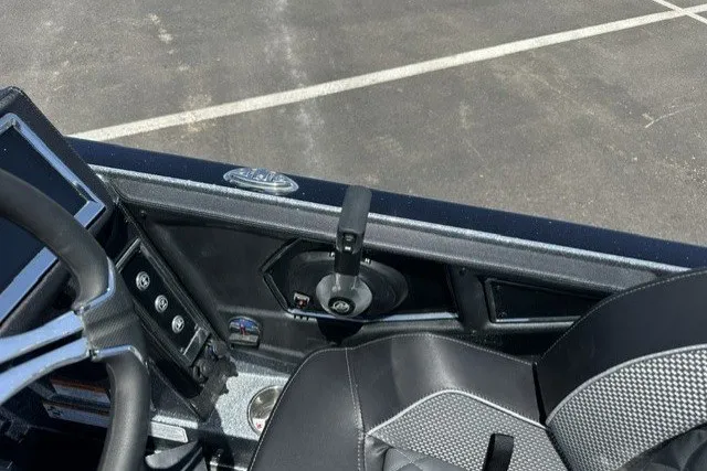 Slide: The Image of Interior view of 2026 Ranger Z521R boat cockpit with steering wheel and controls. - 15