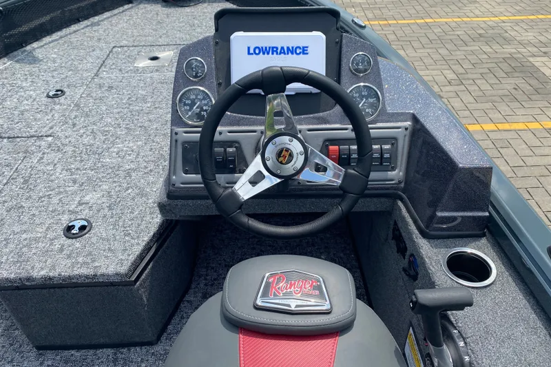 Slide: The Image of 2026 Ranger VS1782SC Angler boat dashboard with Lowrance display and steering wheel. - 4
