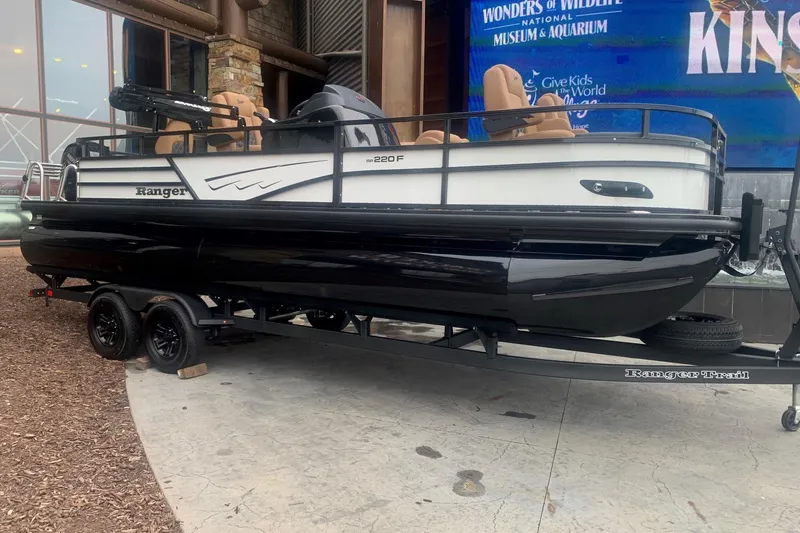 The Image of 2026 Ranger 220F pontoon boat on trailer, displayed outdoors. - 0