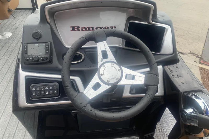 Slide: The Image of Steering console of 2026 Ranger 220F boat with modern controls and sleek design. - 8
