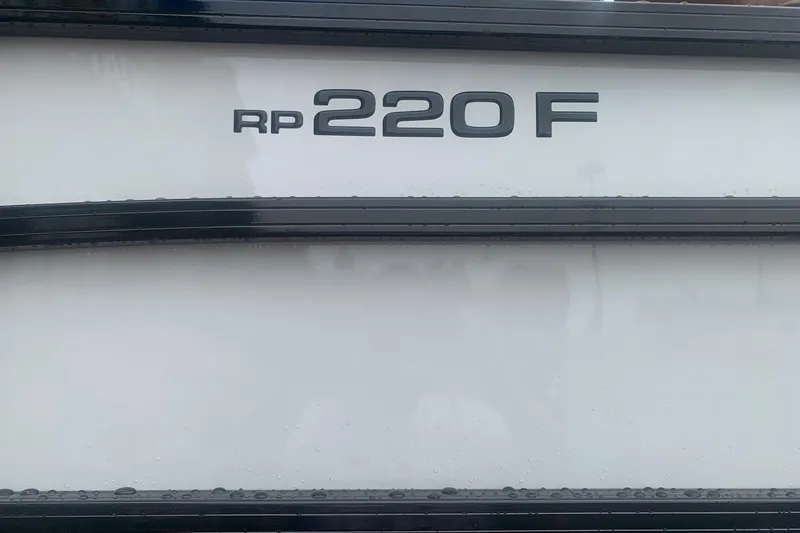 Slide: The Image of Ranger 220F 2026 model nameplate on a sleek white surface. - 4