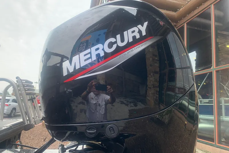 Slide: The Image of Mercury FourStroke engine on 2026 Ranger 220F boat, reflecting surroundings. - 5