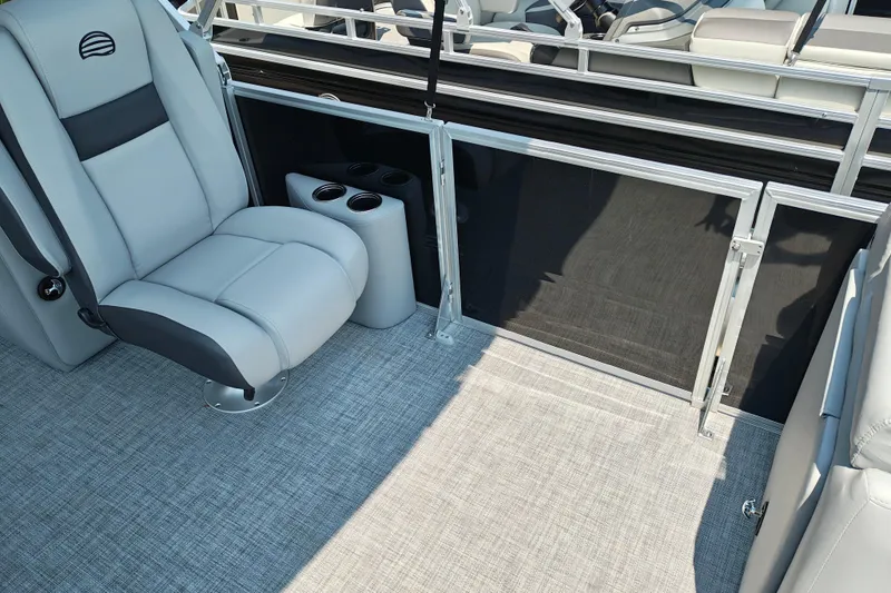 Slide: The Image of 2026 Sun Tracker Party Barge 24 XP3 interior with gray seating and cup holders. - 14