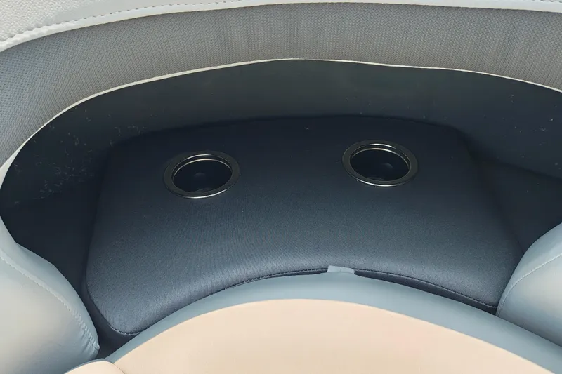 Slide: The Image of 2026 Sun Tracker Party Barge 24 XP3 cup holders on cushioned seating. - 11