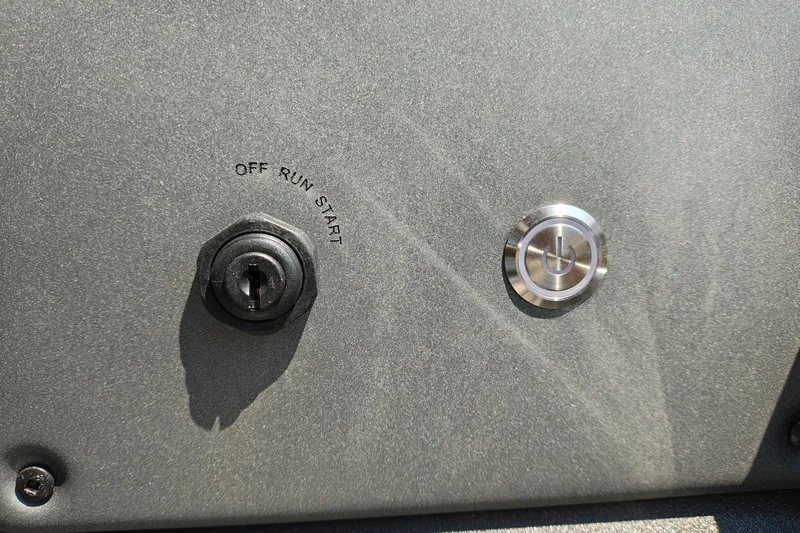 Slide: The Image of Ignition switch and power button on 2026 Sun Tracker Party Barge 24 XP3. - 19