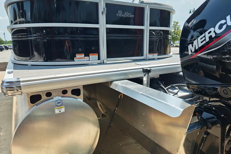 Slide: The Image of 2026 Sun Tracker Party Barge 24 XP3 with Mercury engine, showcasing pontoon and motor details. - 5