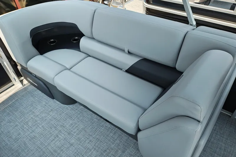 Slide: The Image of Luxurious seating on 2026 Sun Tracker Party Barge 24 XP3 with cup holders and sleek design. - 23