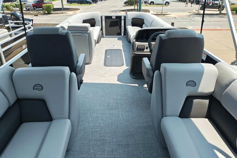 Slide: The Image of 2026 Sun Tracker Party Barge 24 XP3 interior with plush seating and modern helm. - 29