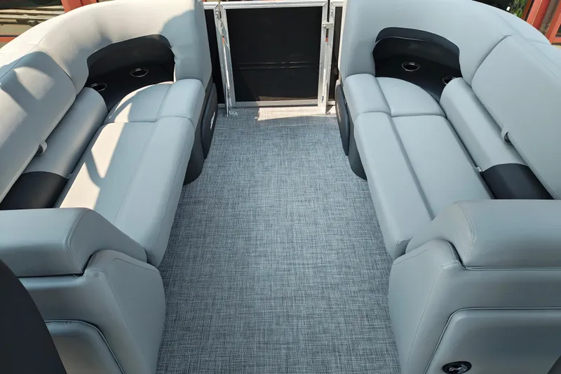 Slide: The Image of Interior of 2026 Sun Tracker Party Barge 24 XP3 with plush seating and modern design. - 22