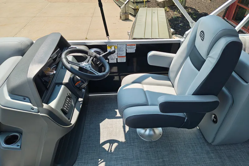 Slide: The Image of Captain's chair and helm of 2026 Sun Tracker Party Barge 24 XP3 pontoon boat. - 16
