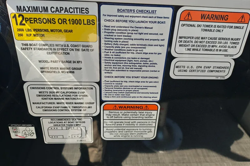 Slide: The Image of 2026 Sun Tracker Party Barge 24 XP3 capacity and safety labels, including emissions and warnings. - 21