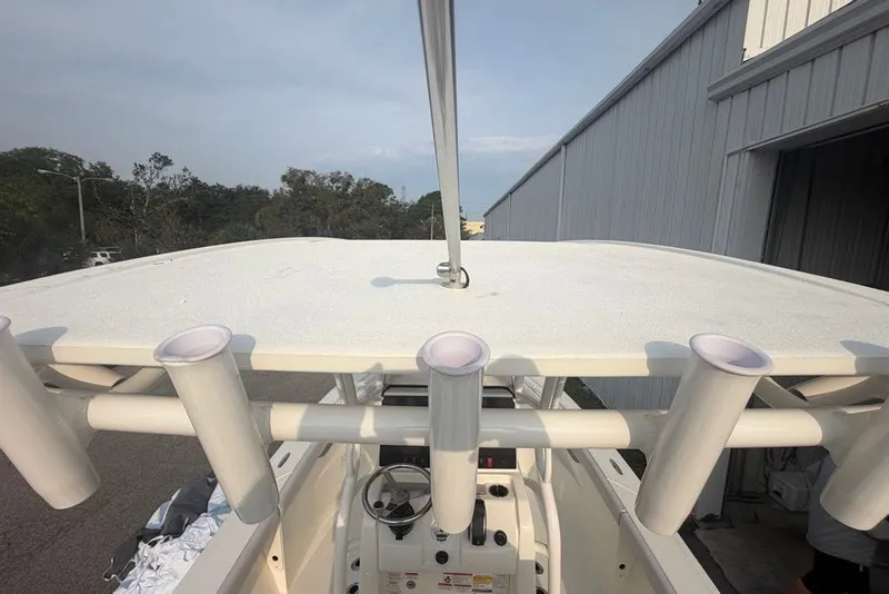 Slide: The Image of 2026 Mako 226 Center Console boat with rod holders and steering console. - 66