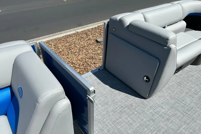 Slide: The Image of 2026 Sun Tracker Party Barge 20 DLX with gray seating and blue accents. - 17