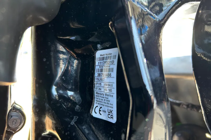 Slide: The Image of Close-up of a Mercury Marine engine label on a 2026 Sun Tracker Party Barge 20 DLX. - 98