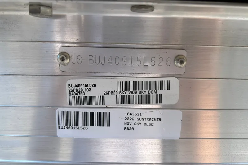 Slide: The Image of 2026 Sun Tracker Party Barge 20 DLX identification plate with serial numbers and labels. - 97