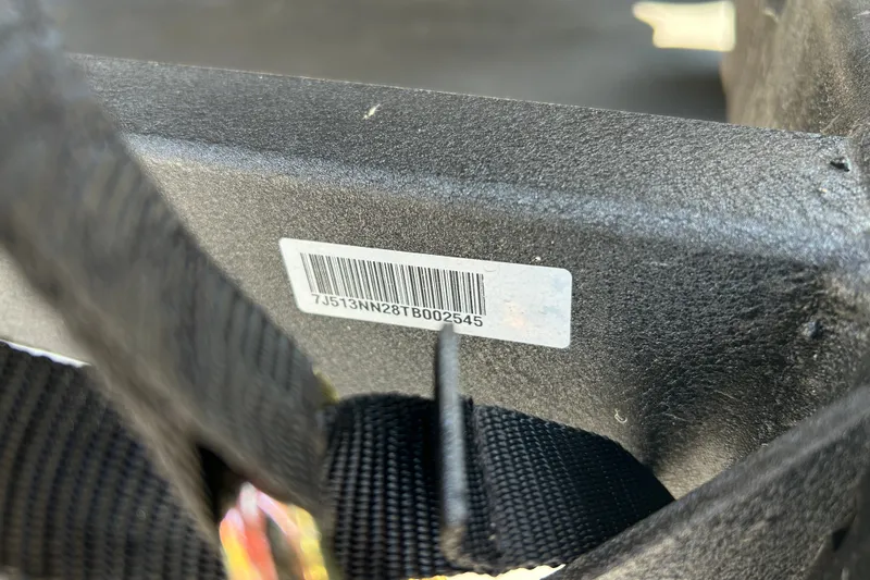 Slide: The Image of Close-up of a boat part with a barcode sticker. - 100