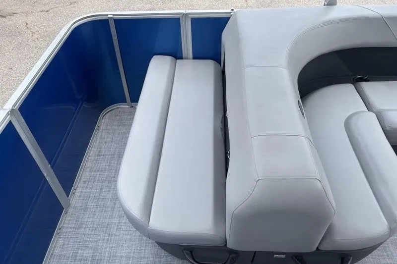 Slide: The Image of 2026 Sun Tracker Party Barge 18 DLX with gray seating and blue paneling. - 21
