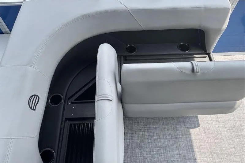Slide: The Image of 2026 Sun Tracker Party Barge 18 DLX interior seating with cup holders and sleek design. - 20