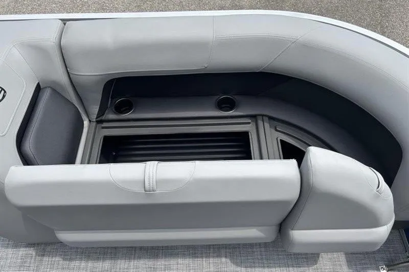 Slide: The Image of 2026 Sun Tracker Party Barge 18 DLX seating area with storage compartment. - 14