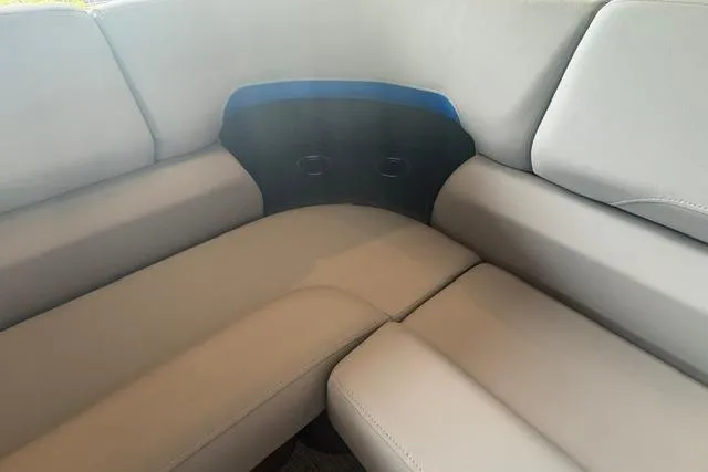 Slide: The Image of Interior seating of 2026 Sun Tracker Party Barge 20 DLX, featuring comfortable gray upholstery. - 3