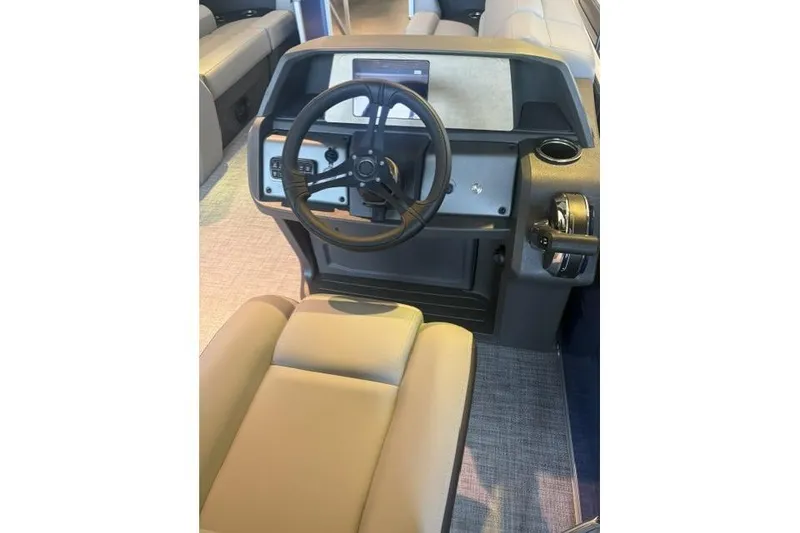 The Image of 2026 Sun Tracker Party Barge 20 DLX helm with steering wheel and controls. - 0