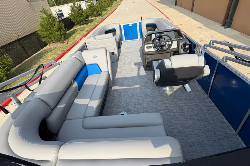 Slide: The Image of 2026 Sun Tracker Party Barge 20 DLX interior with spacious seating and modern helm. - 14