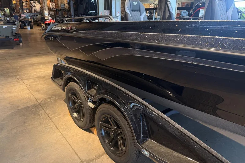 Slide: The Image of 2026 Ranger 621FS Cup-Equipped boat with sleek black design and dual-axle trailer. - 6