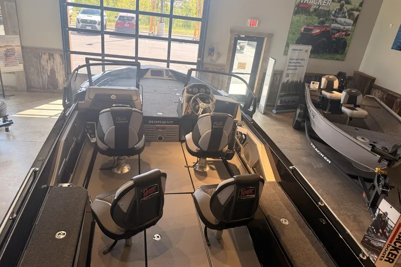 Slide: The Image of 2026 Ranger 621FS Cup-Equipped boat interior with seating, displayed in showroom. - 10