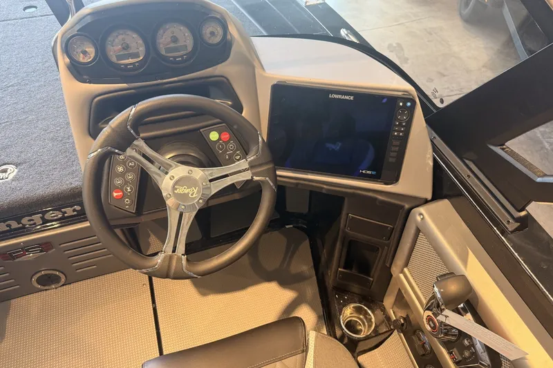 Slide: The Image of 2026 Ranger 621FS Cup-Equipped boat dashboard with steering wheel and Lowrance display. - 3