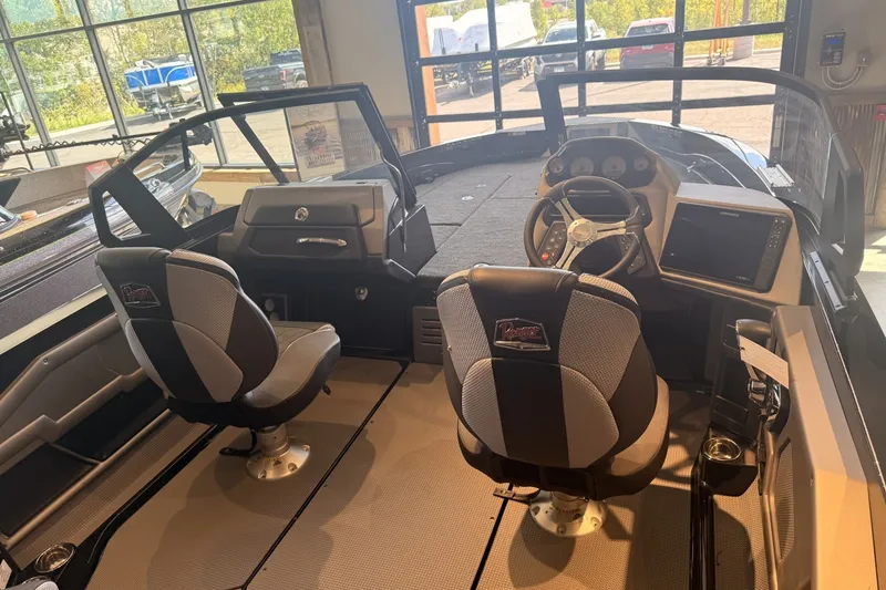 Slide: The Image of Interior of 2026 Ranger 621FS Cup-Equipped boat with modern dashboard and seating. - 9