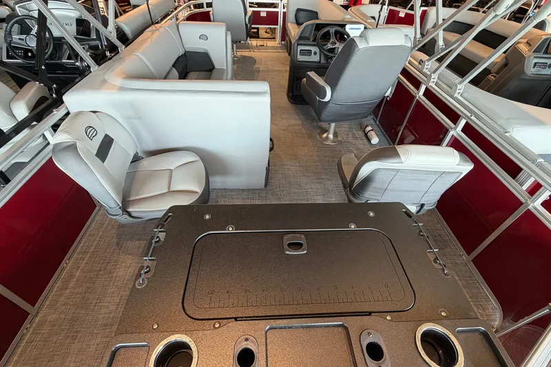 Slide: The Image of 2026 Sun Tracker Bass Buggy 18 DLX interior with seating and steering console. - 13