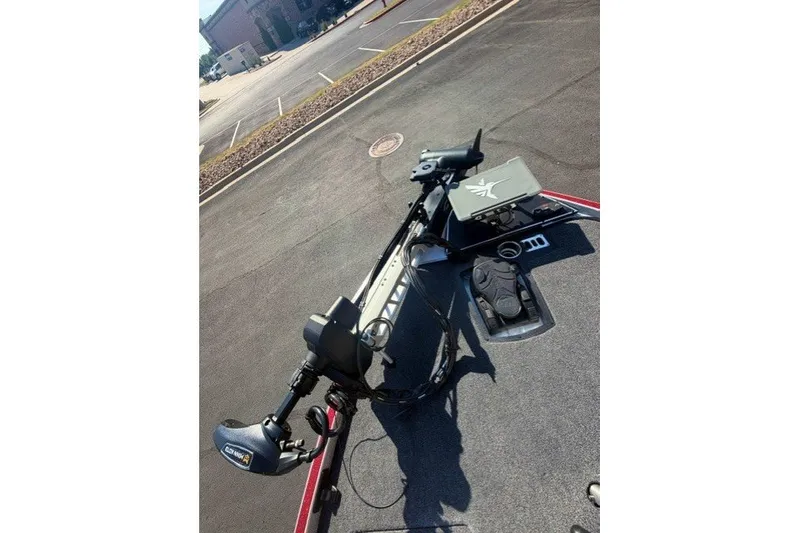 Slide: The Image of 2026 Ranger Z520R boat with advanced trolling motor and control panel in a parking lot. - 10