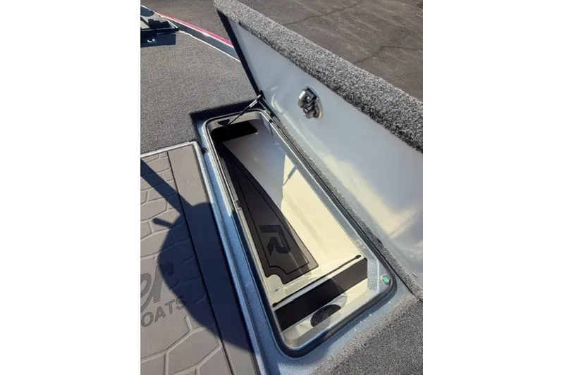Slide: The Image of Open storage compartment in 2026 Ranger Z520R boat, showcasing interior design and functionality. - 11