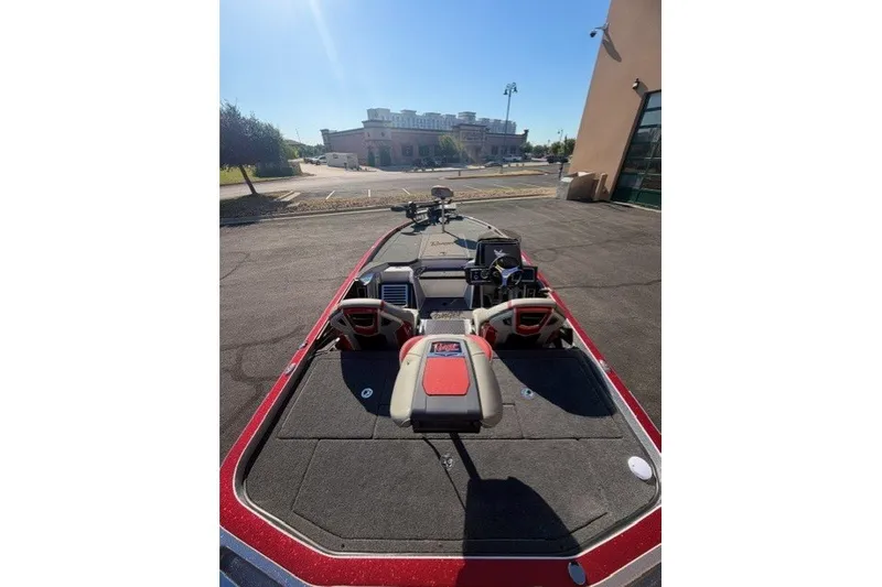 Slide: The Image of 2026 Ranger Z520R boat parked outdoors, showcasing deck and seating area. - 5