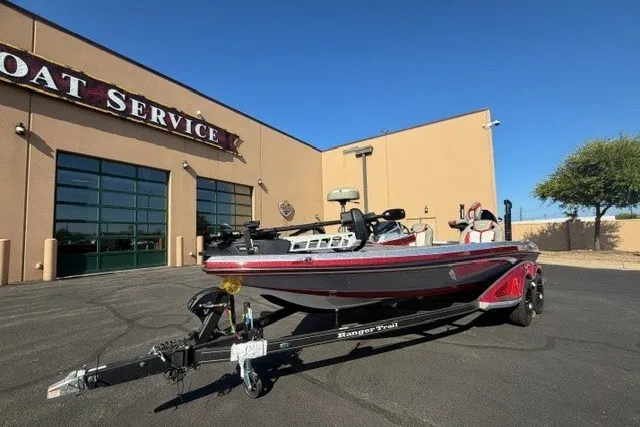 Slide: The Image of 2026 Ranger Z520R boat parked outside a service center on a sunny day. - 1