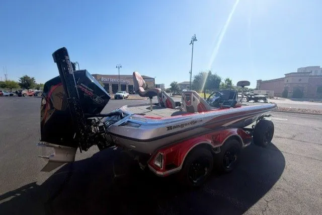 Slide: The Image of 2026 Ranger Z520R boat in parking lot, featuring sleek design and powerful engine. - 4