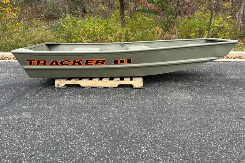 The Image of 2026 Tracker Grizzly 10 Jon boat on wooden pallet, outdoors on asphalt. - 0