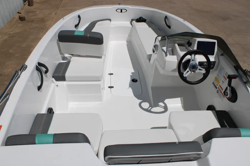 Slide: The Image of 2026 Tahoe T16 boat interior with modern seating and steering console. - 7