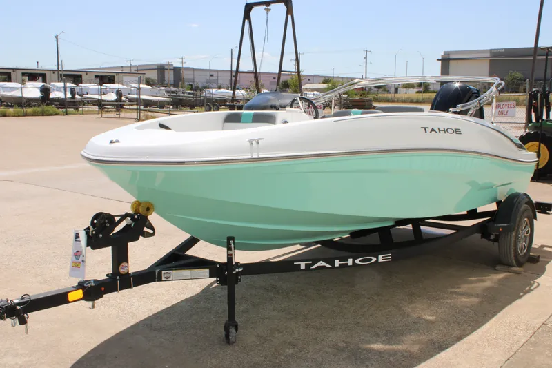 Slide: The Image of 2026 Tahoe T16 boat on trailer in outdoor setting. - 2