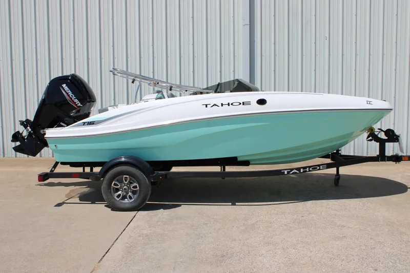The Image of 2026 Tahoe T16 boat with Mercury engine on trailer, parked outdoors. - 0