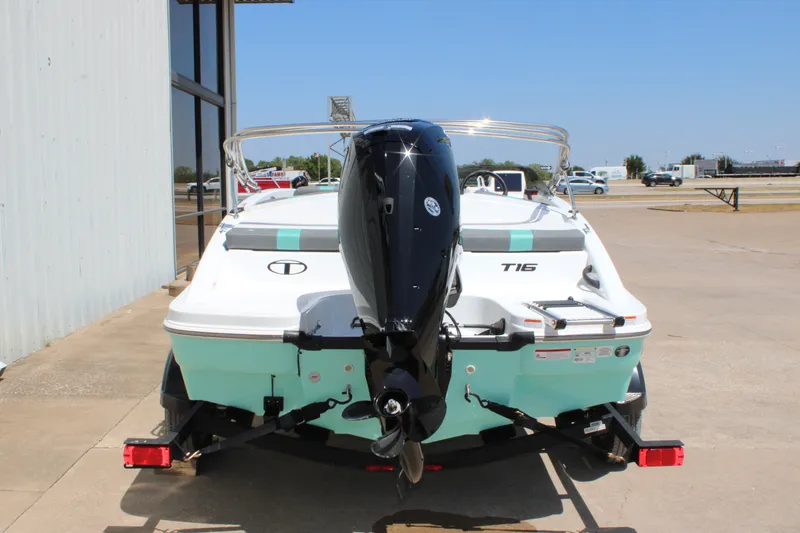 Slide: The Image of 2026 Tahoe T16 boat with outboard motor, parked on a trailer in a sunny outdoor setting. - 5