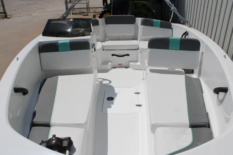 Slide: The Image of 2026 Tahoe T16 boat interior with white and gray seating, teal accents, and modern design. - 6