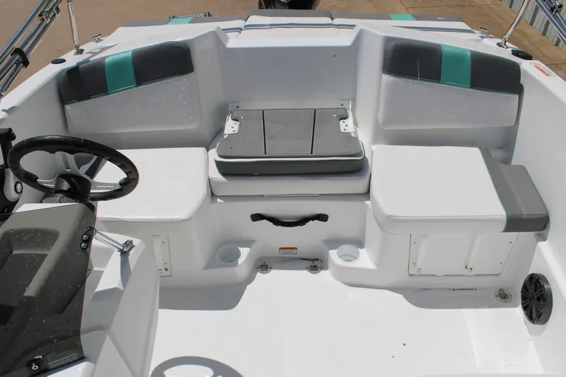 Slide: The Image of Interior of a 2026 Tahoe T16 boat featuring seating and steering wheel. - 9