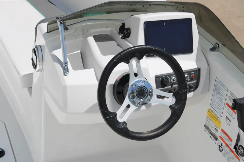 Slide: The Image of Steering console of 2026 Tahoe T16 boat with modern controls and display. - 8