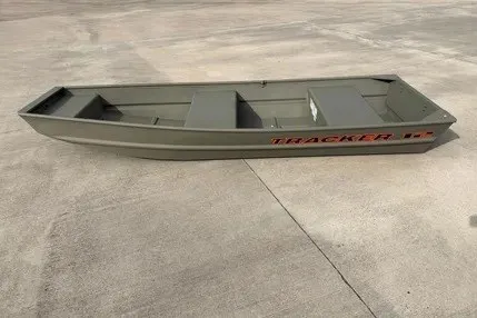 The Image of 2026 Tracker Grizzly 12 Jon boat on concrete surface, showcasing its sturdy design. - 0