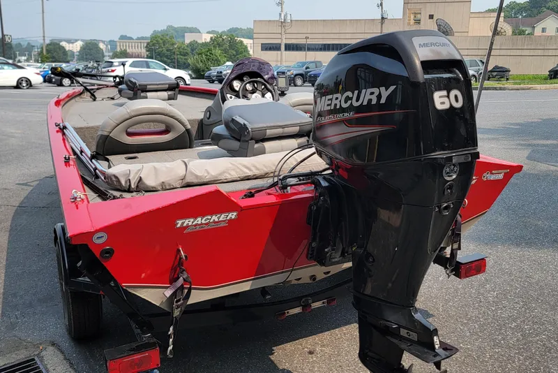 Slide: The Image of 2013 Tracker Pro Team 175 TXW boat with Mercury 60 engine, parked outdoors. - 11