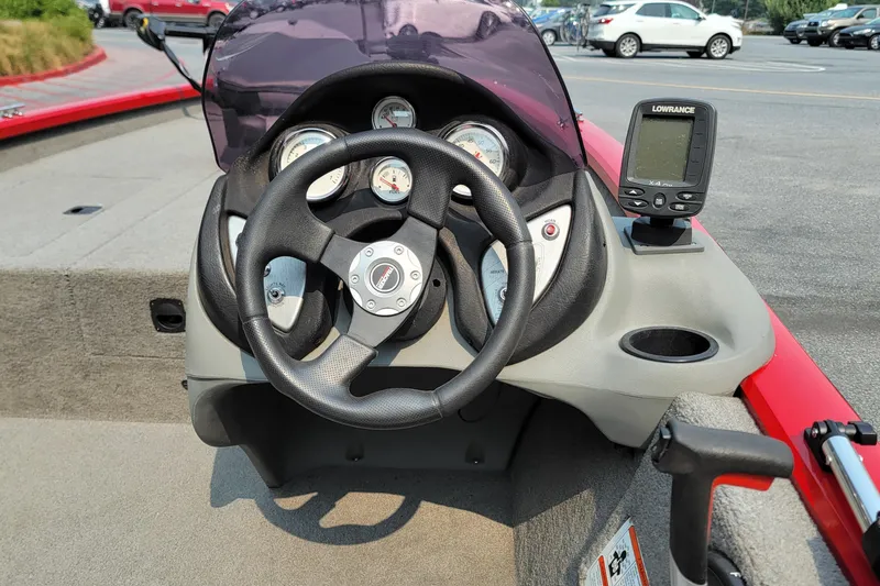 Slide: The Image of Steering console of a 2013 Tracker Pro Team 175 TXW boat with gauges and Lowrance device. - 6